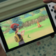 The new Nintendo Switch OLED model, playing a Pokémon game.